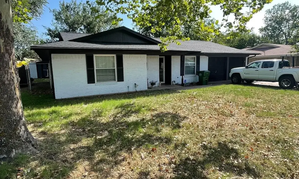 Professional roofing crew working on a residential roof in Palmetto Bay